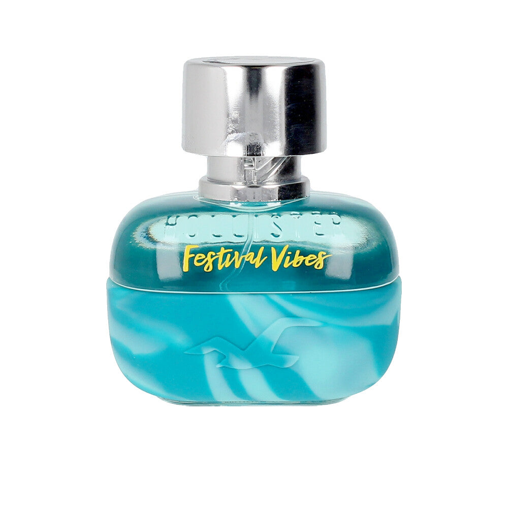 Tall clear glass perfume bottle with light amber liquid, labelled Citrus Woody Eau de Parfum, 50 ml