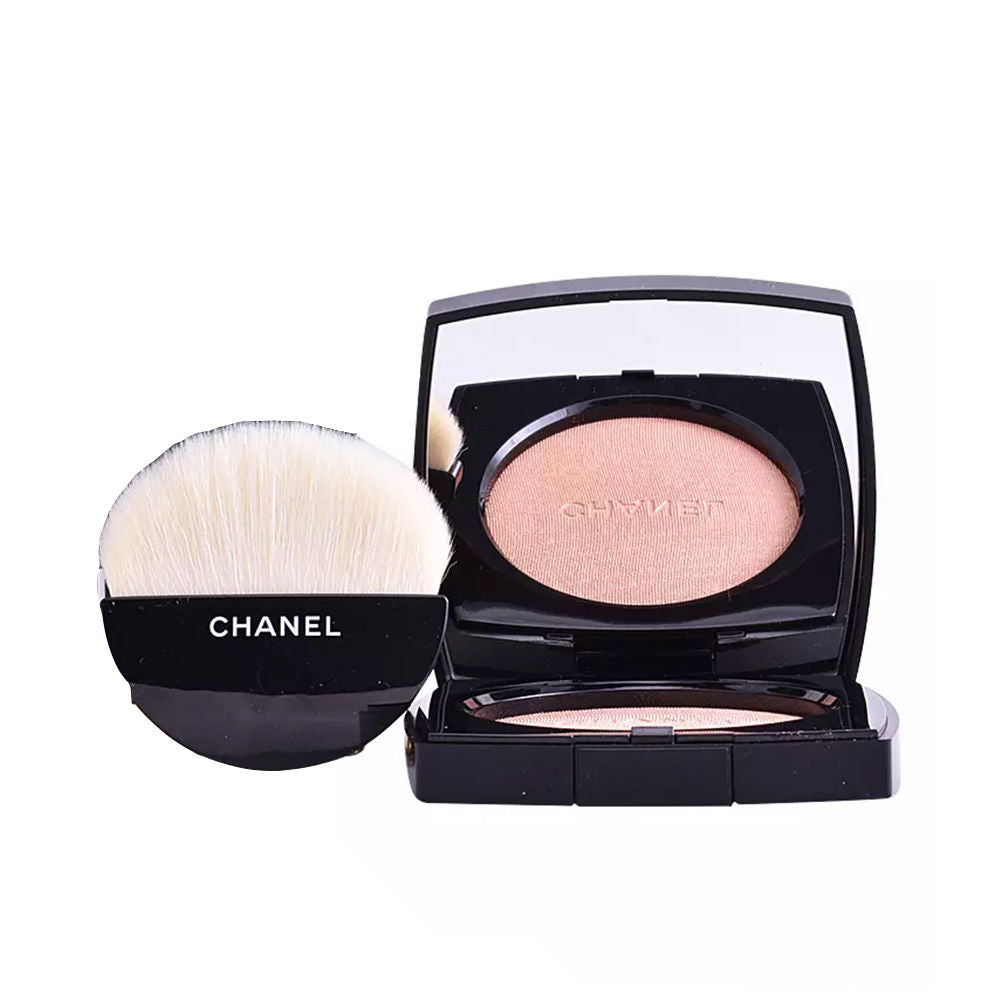 Black compact with warm-gold cream-to-powder highlighter and small brush