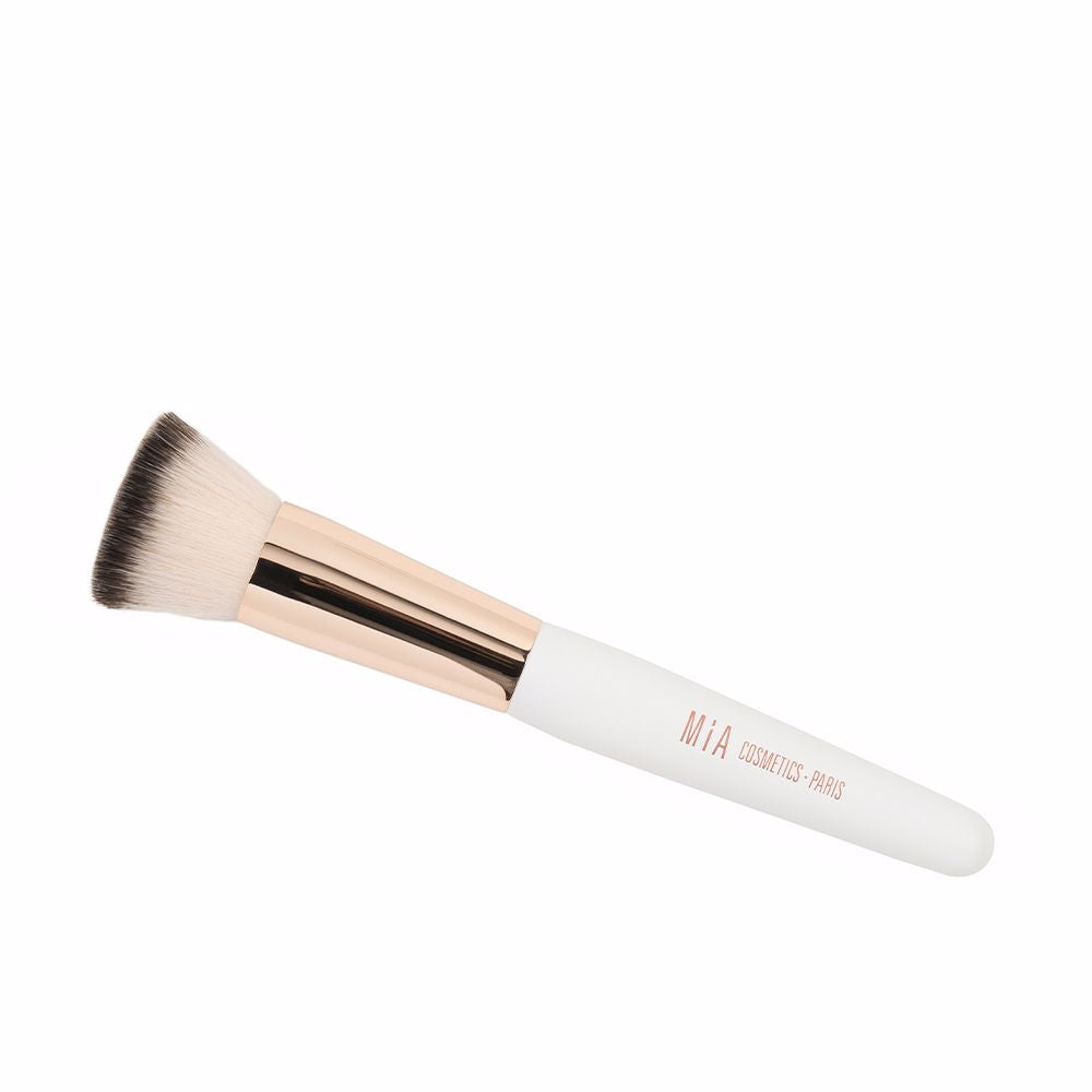 Compact synthetic foundation brush with dense rounded head and polished handle