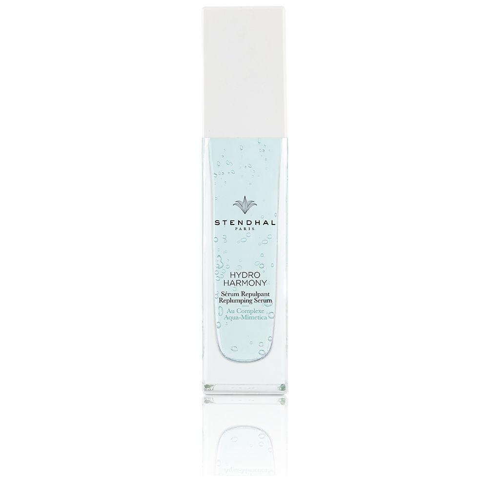 30 ml clear serum bottle with pale blue gel beside botanical extracts