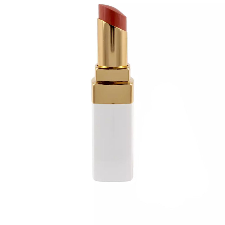 Chanel Slim red lip balm with angled tip, shiny gold band and rectangular white plastic base