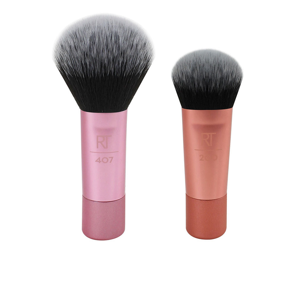Two compact Real Techniques face brushes with plush heads and short travel handles
