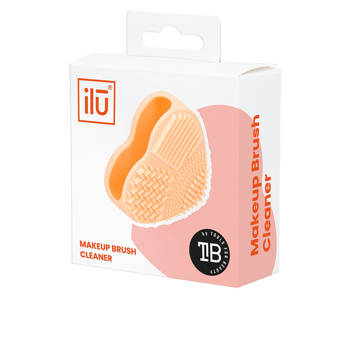 Orange silicone brush cleaner pad with varied textured surfaces, single unit