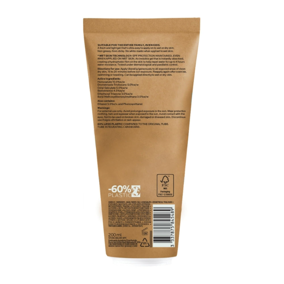 la Roche Posay Brown, blue and orange sunscreen tube with cartoon characters, prominent SPF number, sun icon, and QR code