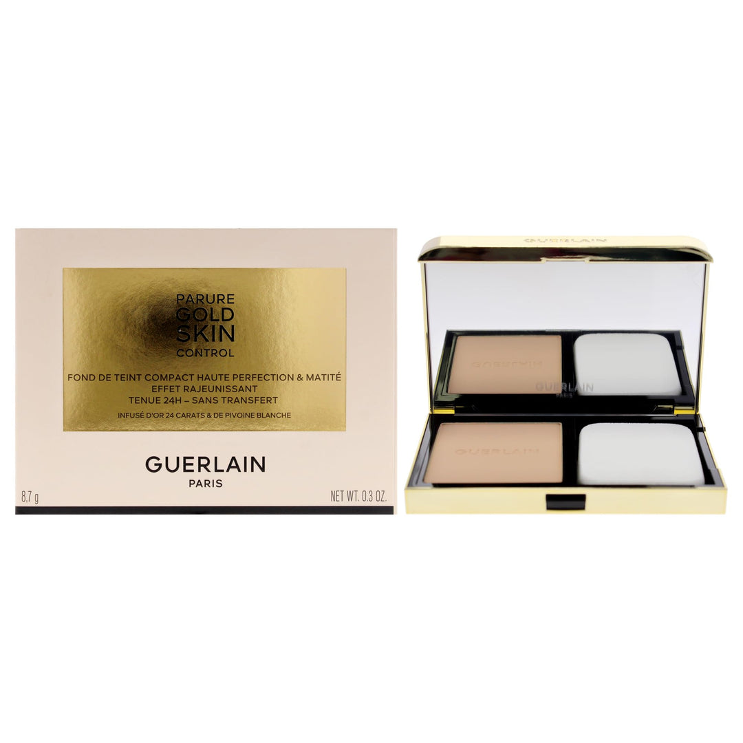Compact powder foundation in black case, 10 g, gold‑infused pressed powder