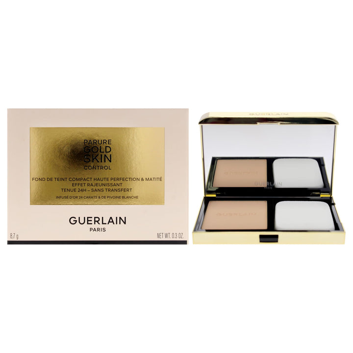 Compact powder foundation in black case, 10 g, gold‑infused pressed powder