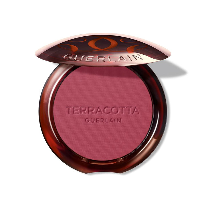 Mini terracotta powder blush compact in rose shade, lightweight finish