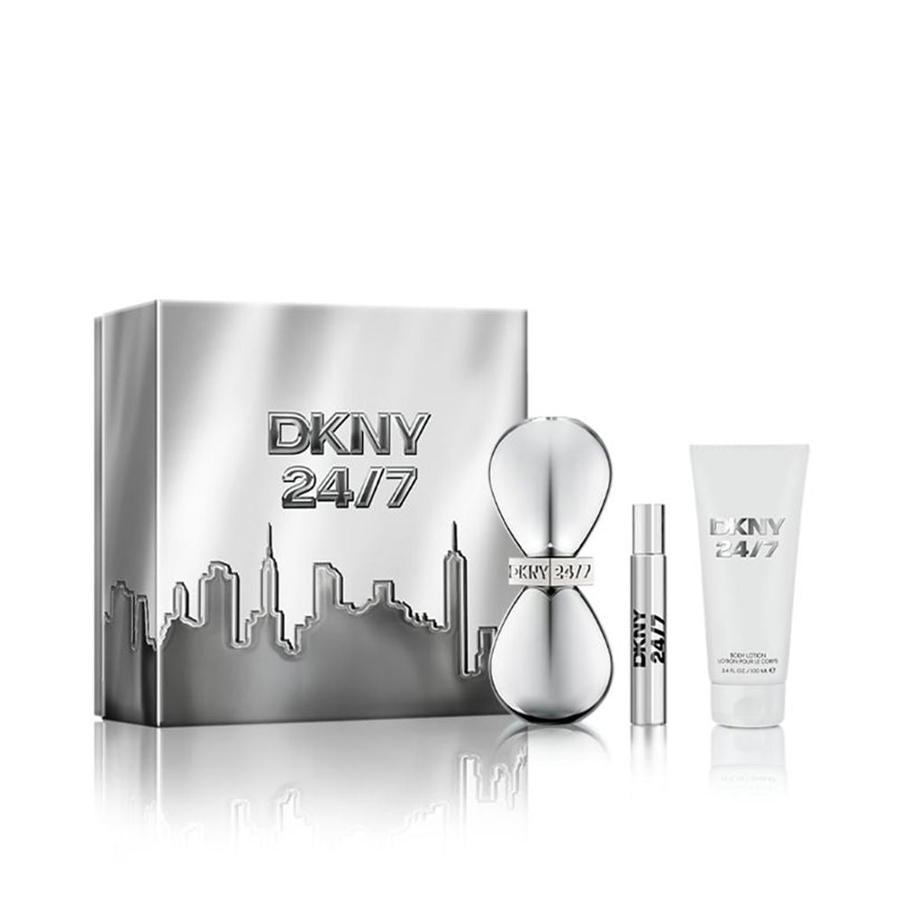 Three-piece woody‑floral fragrance set with hourglass bottle, gift packaging