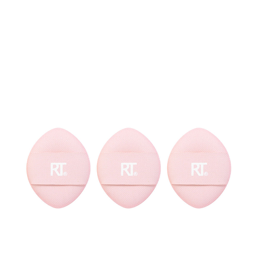 Real Techniques Three pink fabric teardrop sponges with textured surfaces and middle straps, presented together