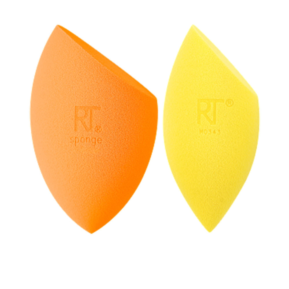 Real Techniques duo: foundation brush and contouring concealer sponge on white background