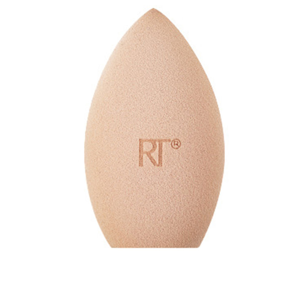 Real Techniques Beige foam teardrop makeup sponge with soft texture, rounded edges, and subtle logo imprint