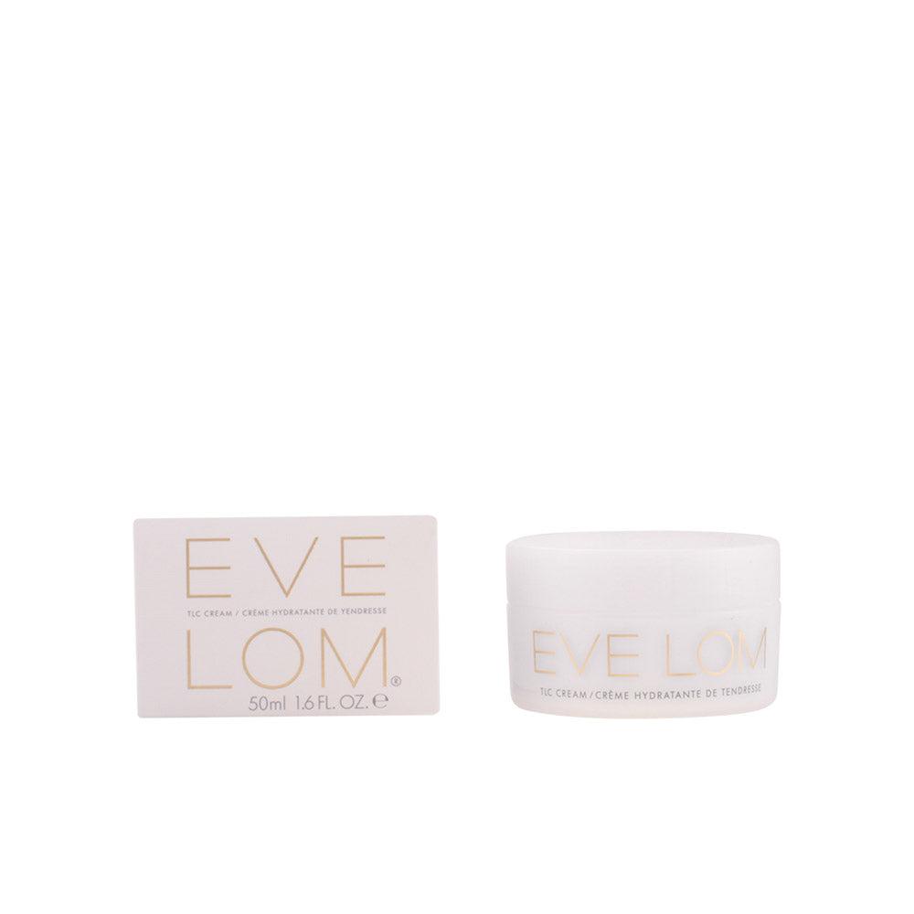 Eve Lom White cylindrical face cream jar with gold text and smooth plastic surface, minimalist box nearby