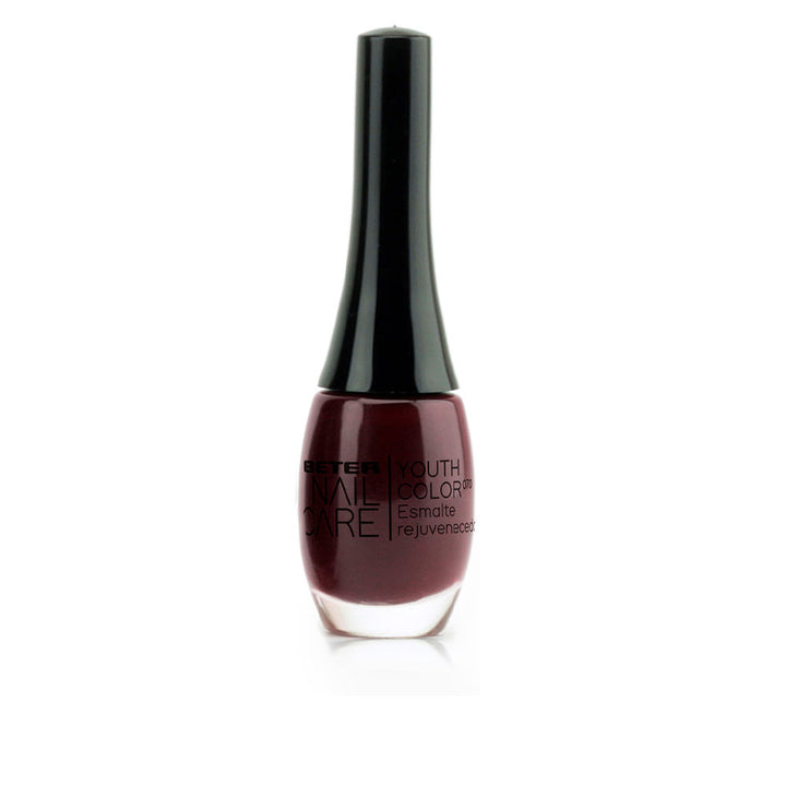 11 ml bottle of deep rouge‑noir glossy nail polish, Unisex treatment lacquer