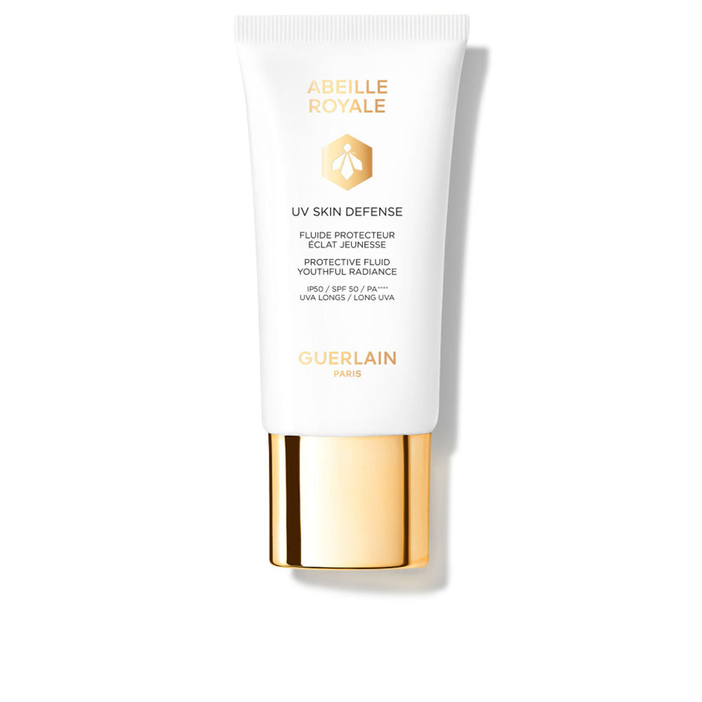 Guerlain White matte plastic sunscreen tube with gold metallic cap, printed logo and bee emblem