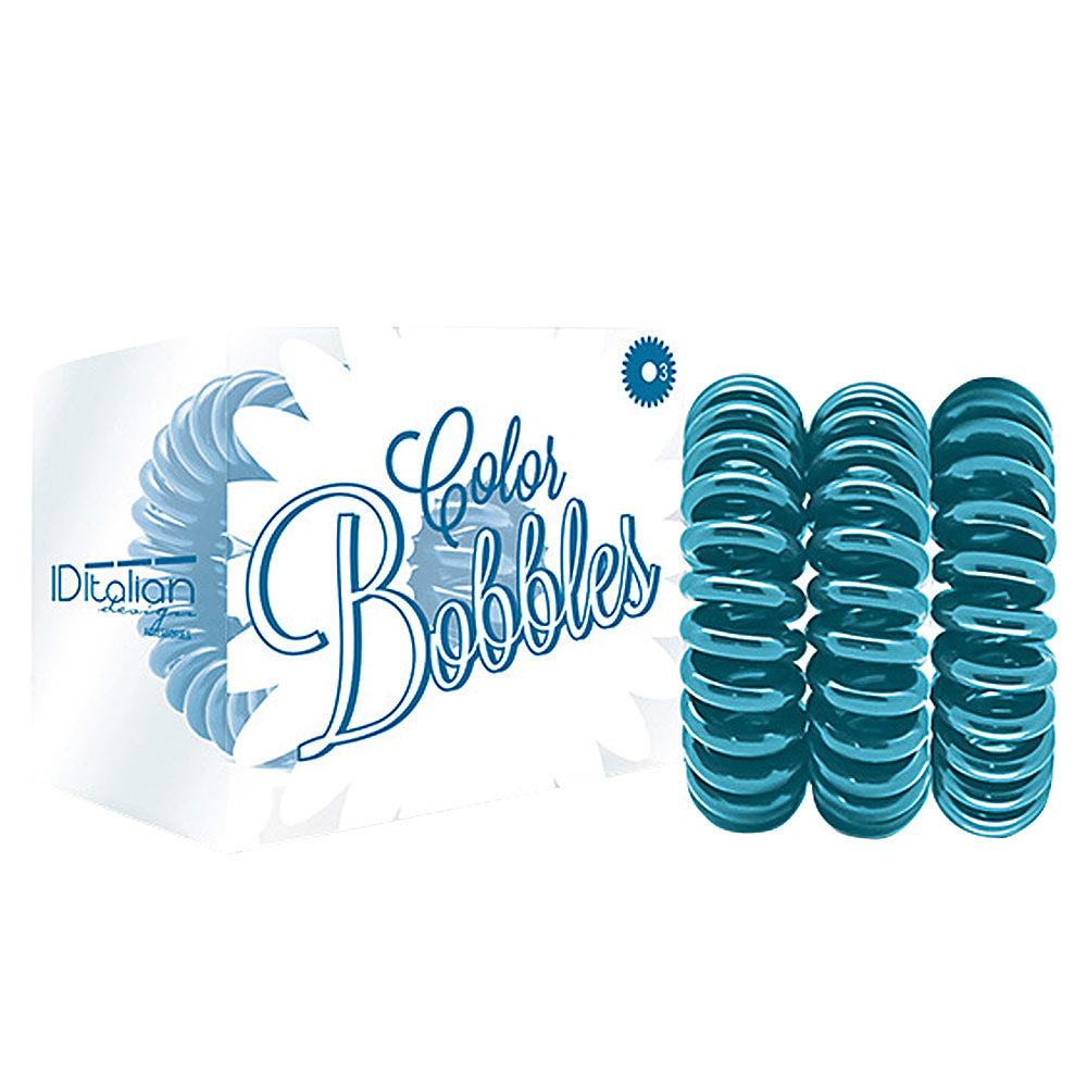 Three turquoise plastic hair bobbles in a small box, pack of three