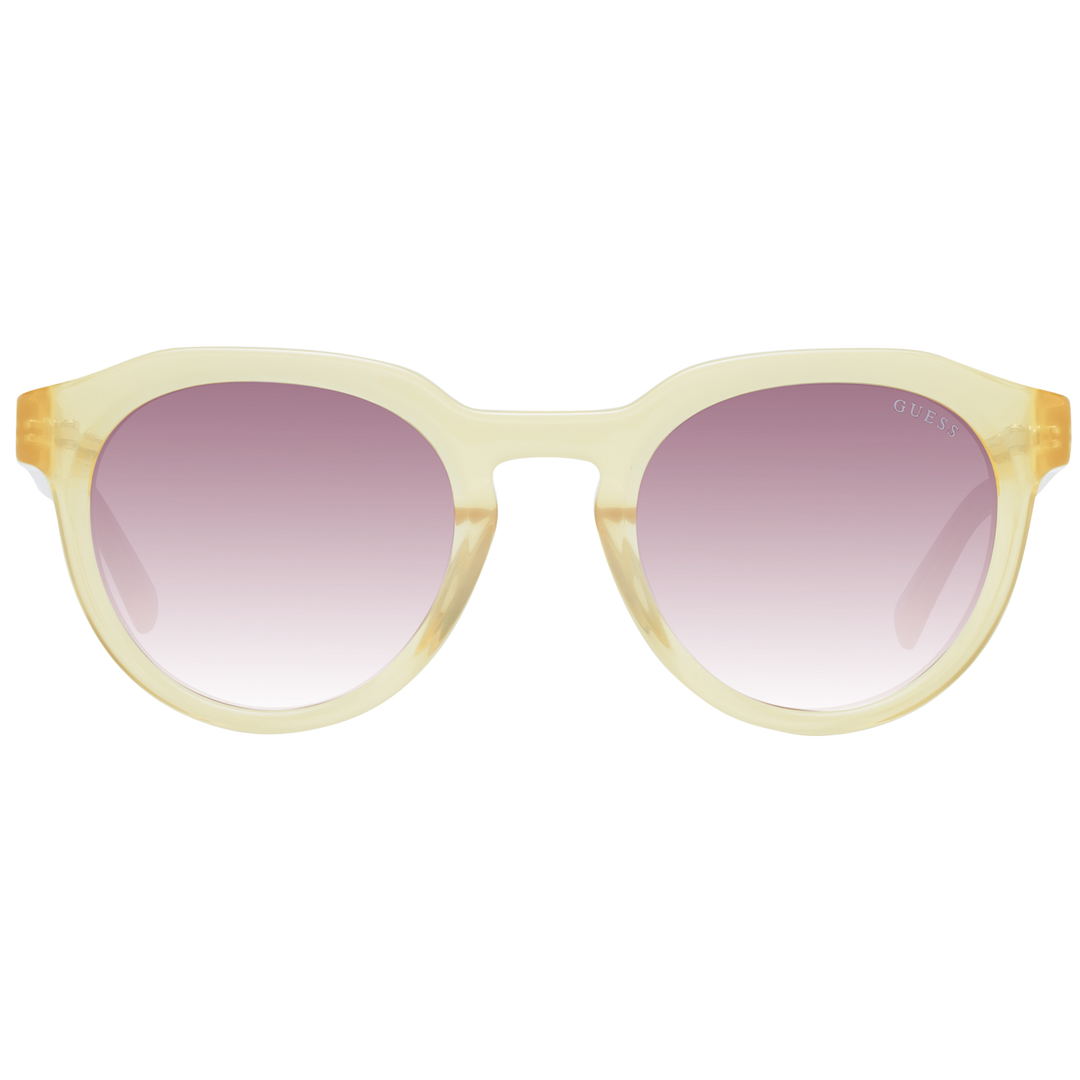 Yellow round sunglasses with purple gradient lenses and Guess logo on lens and temple