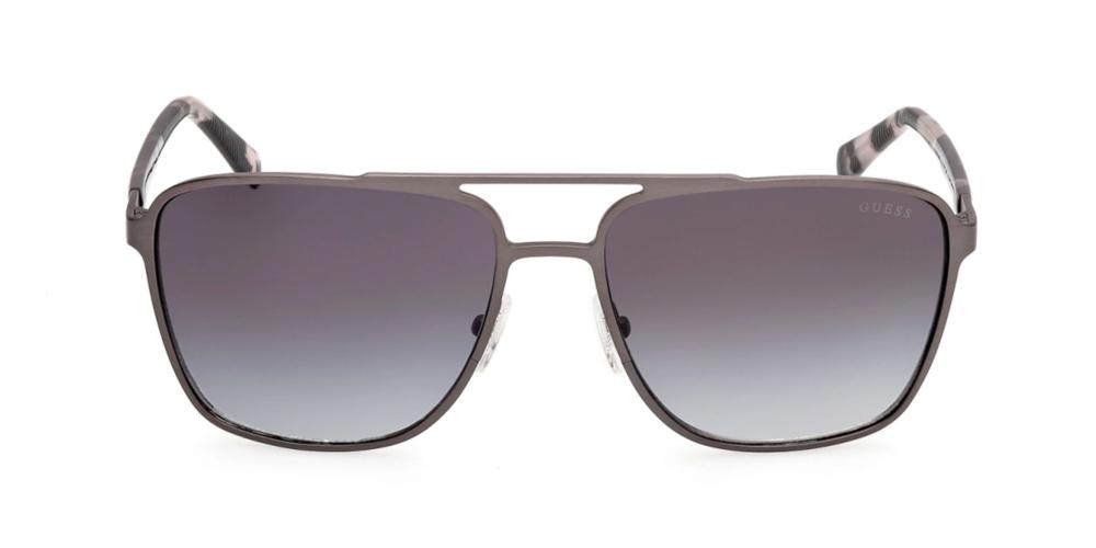 Black metal aviator sunglasses with gradient gray lenses and double bridge, patterned temple tips visible