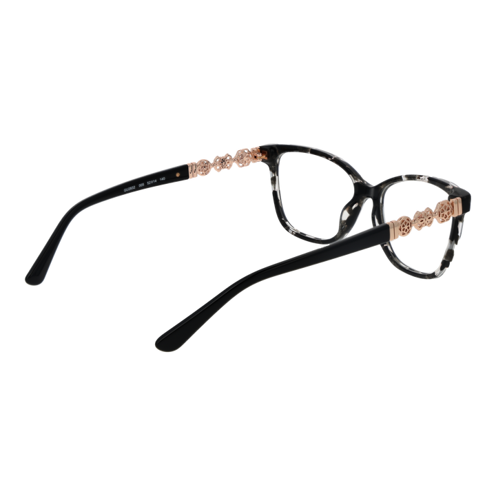Black speckled cat-eye eyeglasses with rose-gold floral temple accents on white background