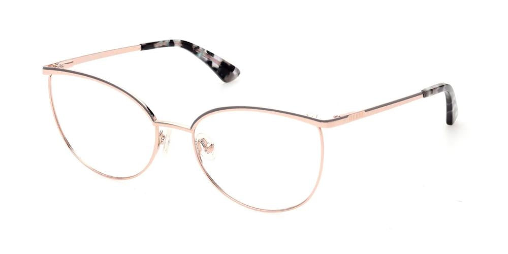 Rose gold thin metal cat-eye eyeglasses with black patterned temple tips on neutral background