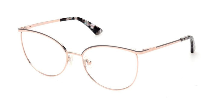 Rose gold thin metal cat-eye eyeglasses with black patterned temple tips on neutral background