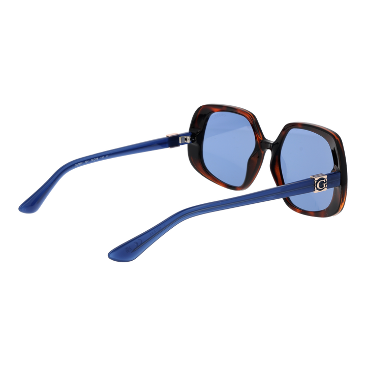 Tortoise shell oversized square sunglasses with blue-tinted lenses and logo temple detail on white background