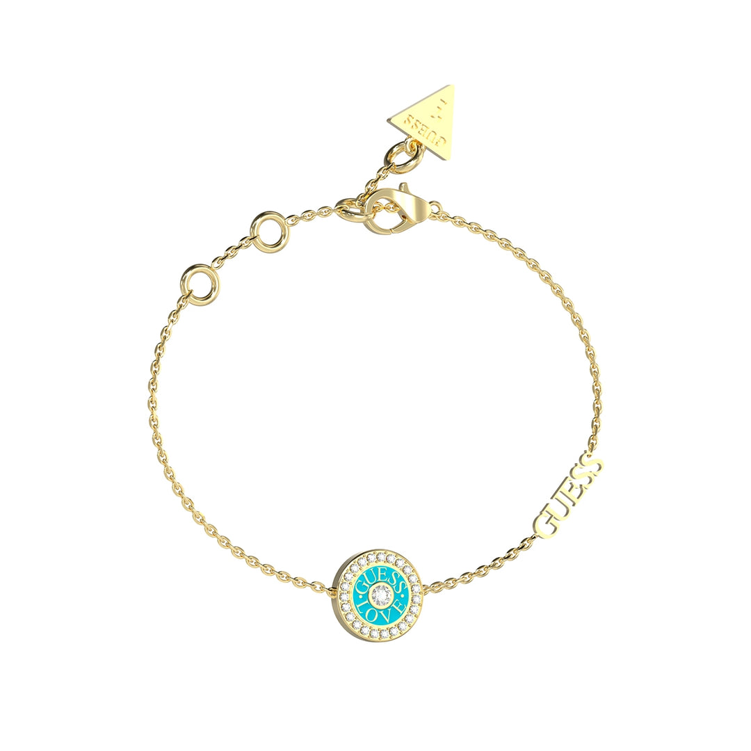 Delicate gold chain bracelet with turquoise and white crystal round charm, lettering charm, and triangle tag