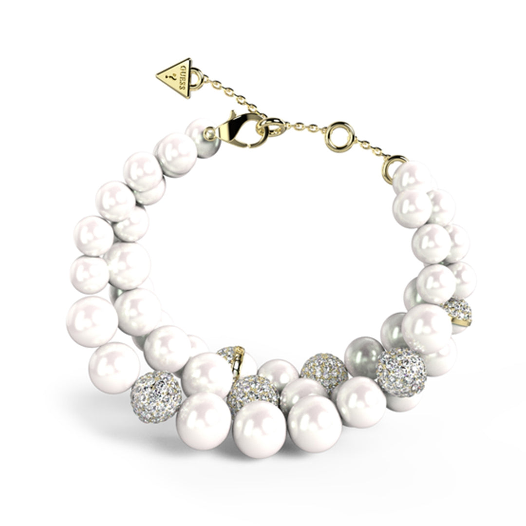 Women’s pearl and rhinestone bracelet with gold and silver chain and triangle charm on wrist
