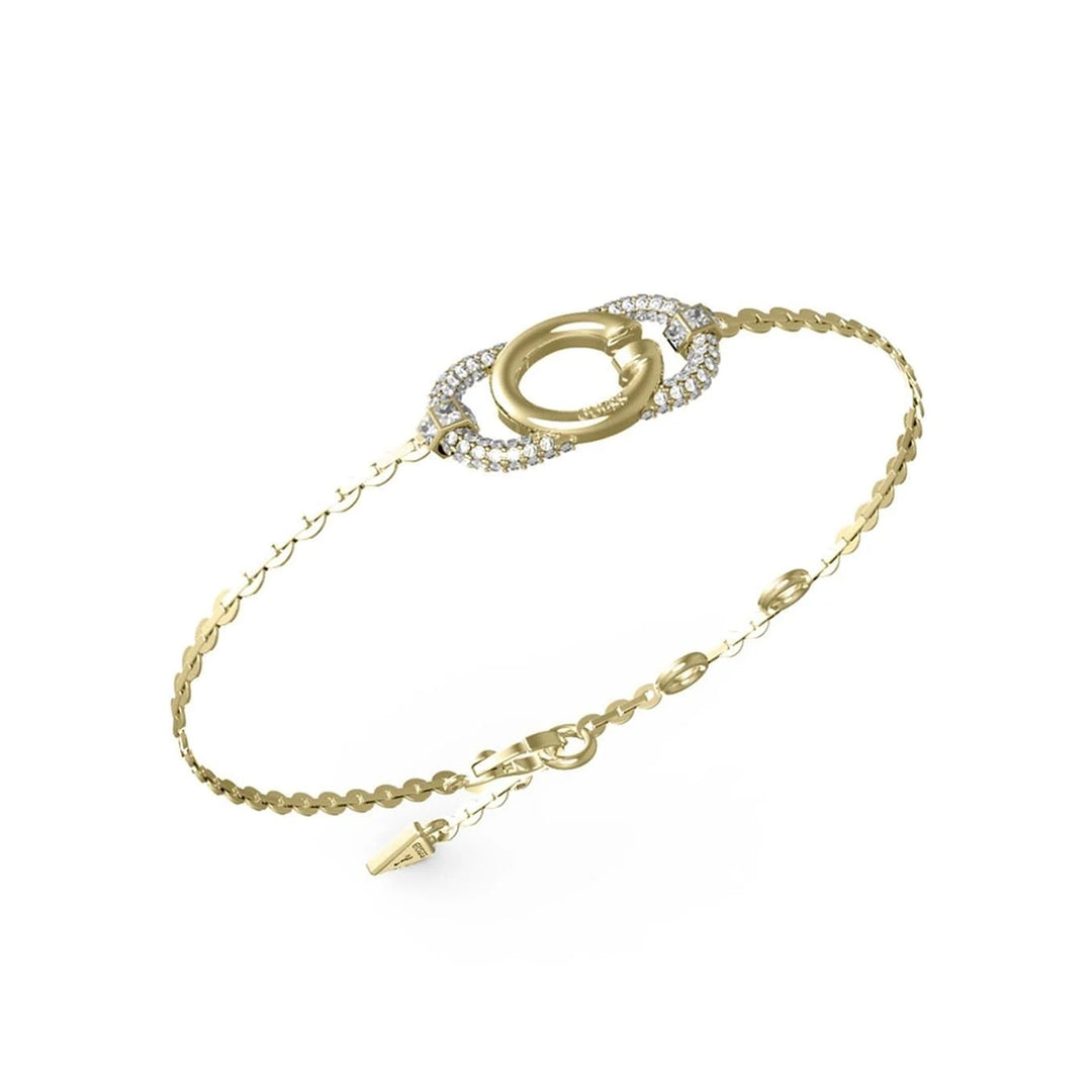 Delicate gold chain bracelet featuring a circular clasp set with small sparkling stones on white background