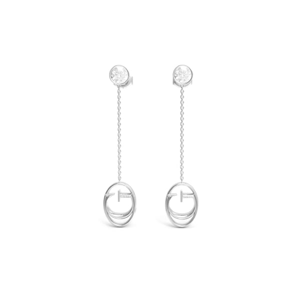 Silver drop earrings: round clear stone stud, chain links, oval pendant on reflective surface