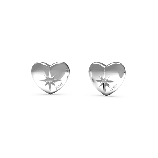 Close-up of silver heart stud earrings with star engraving and small crystal on white background