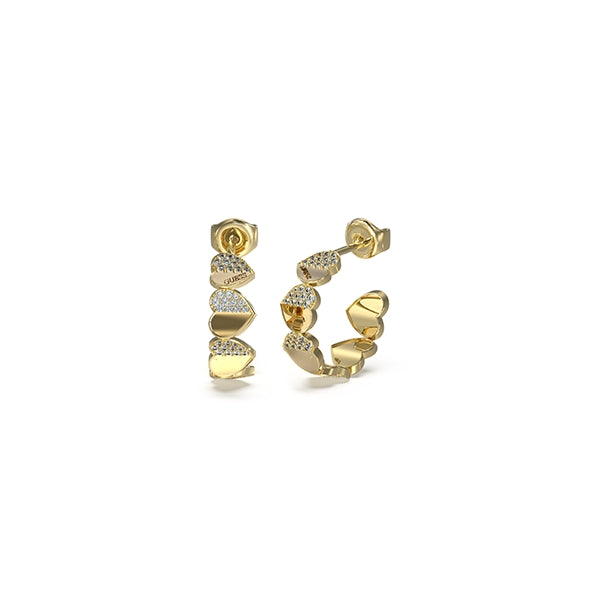 Gold hoop earrings featuring heart-shaped cutouts and small embedded crystals on each hoop, shown on neutral background