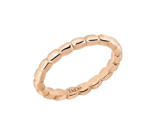 Rose gold beaded narrow ring on white background showing delicate textured band for Women