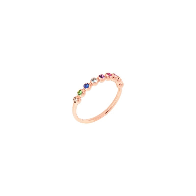Rose gold band ring set with small multicolor gemstones in prong settings, delicate luxury design for Women
