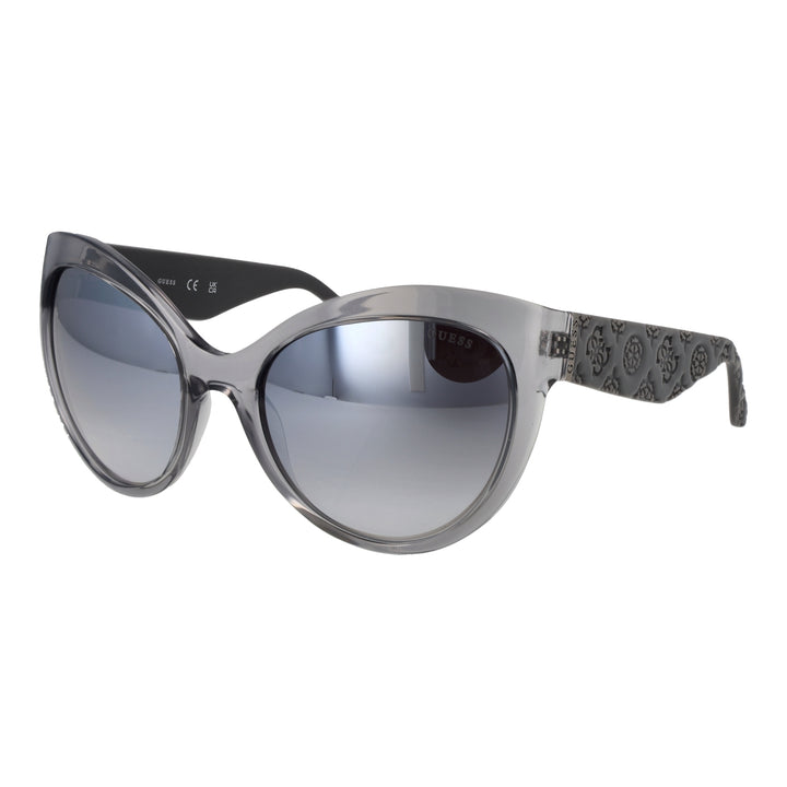 Gray cat-eye sunglasses on neutral background showing embossed temples and gradient lenses