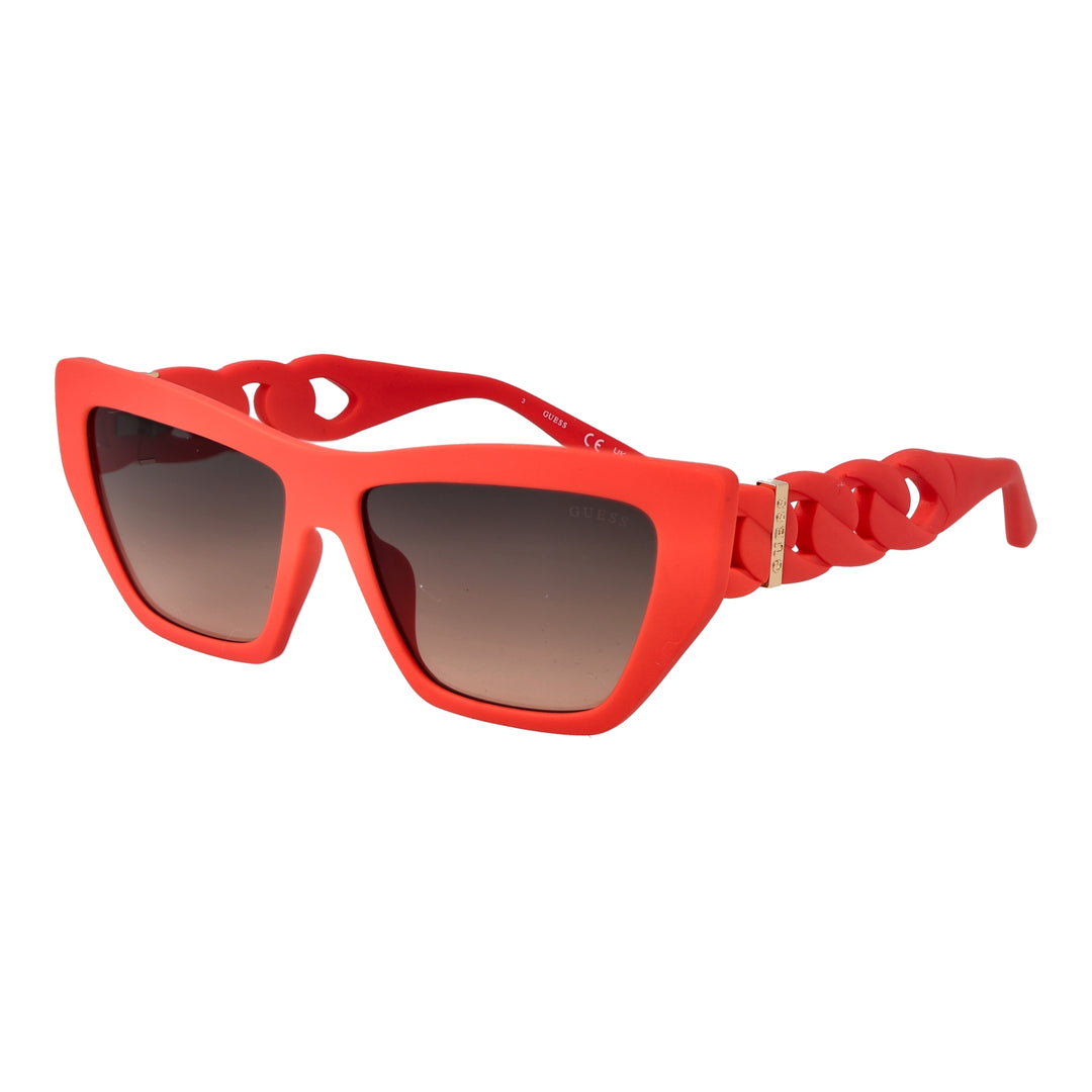 Red cat-eye sunglasses in glossy plastic with gradient lenses and gold chain-link temples, angled three-quarter view