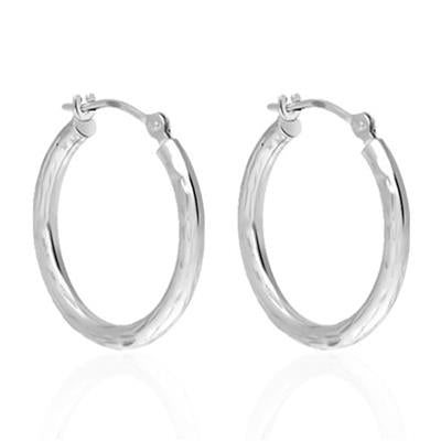 Polished silver hoop earrings with smooth surface on white background, classic circular silhouette